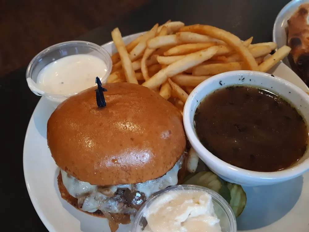 French Onion Burger with Carmelized Onions Swiss and Provolone Read More